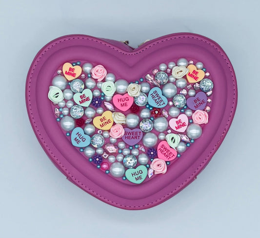 fuchsia pink valentines day love purse shaped like a heart with bling and candy message hearts adorned all over